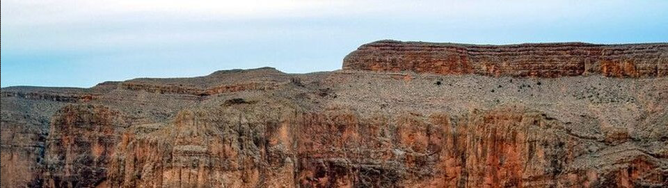 Arizona landscape of red stone cliffs against a blue sky; used with permission